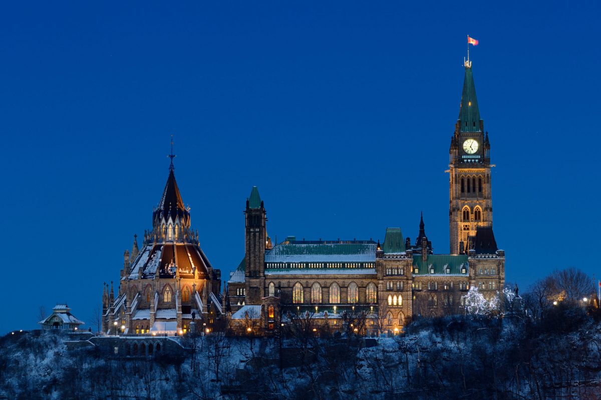 Center Block of Parliament Hill in Ottawa at dusk in winter